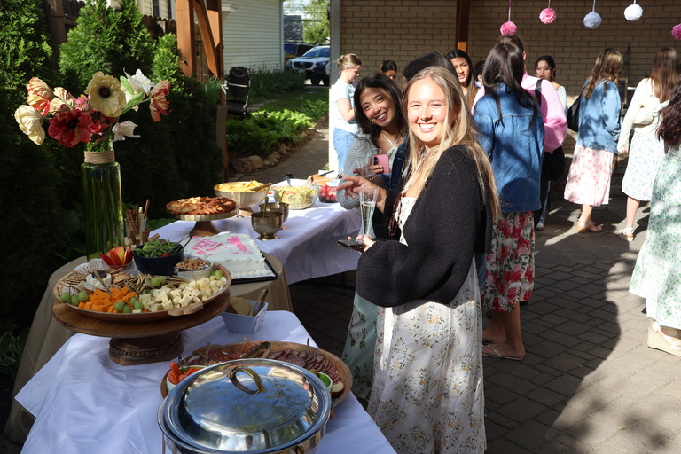 Students grabbing food at the Spring 2026 Graduation celebration