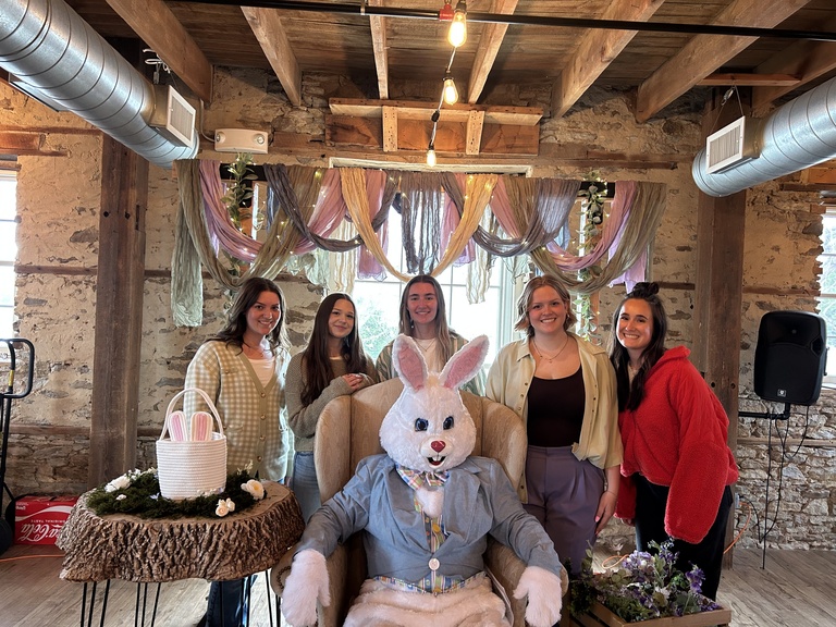 Student group posing for a photo with the Easter Bunny