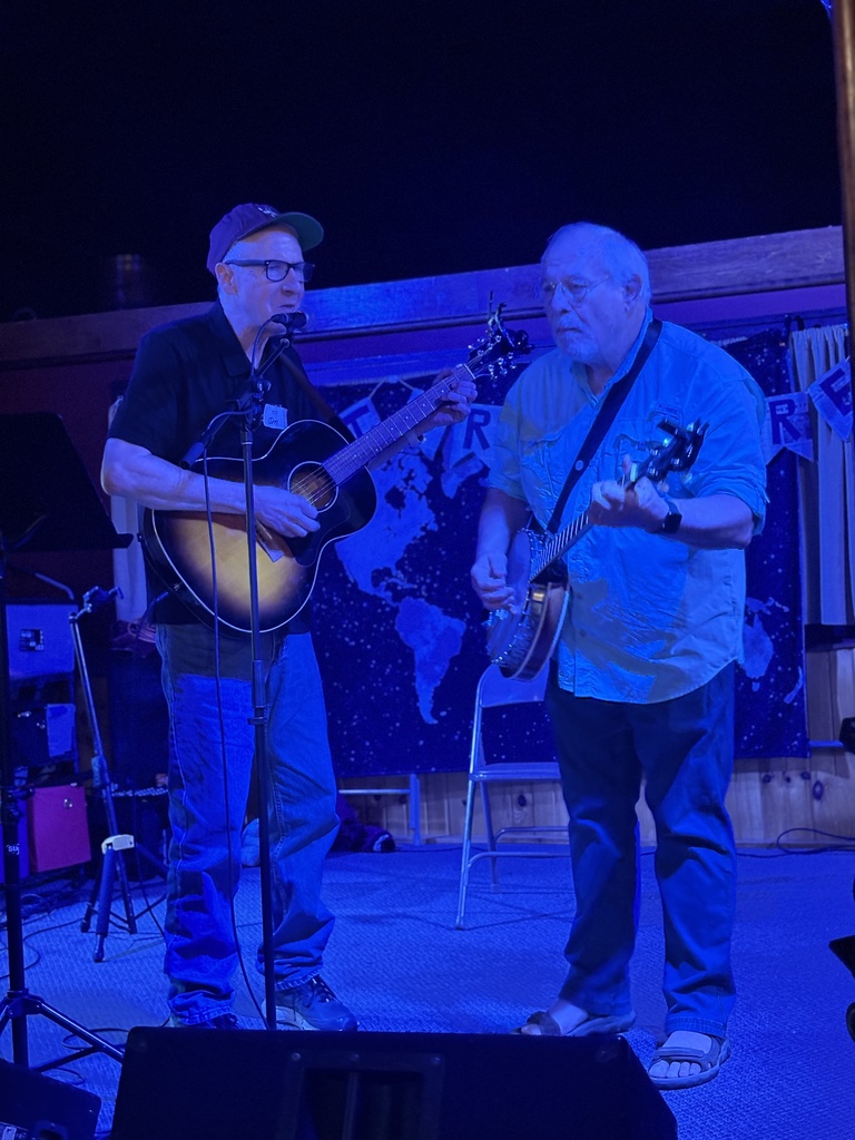 Two men performing at Investigate Midwest event