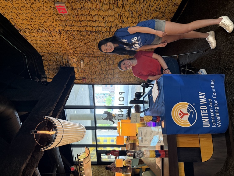 Students posing for a photo while working the United Way Event