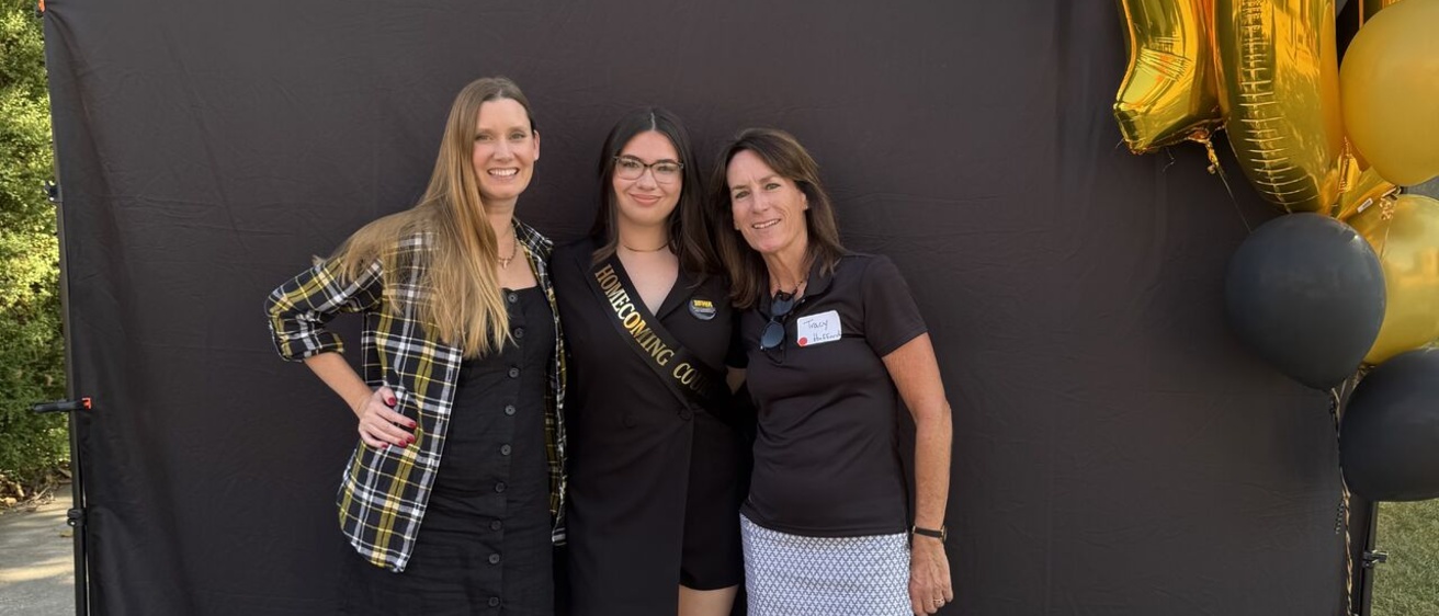 Heather, Tracy and Reanna posing for a homecoming pic