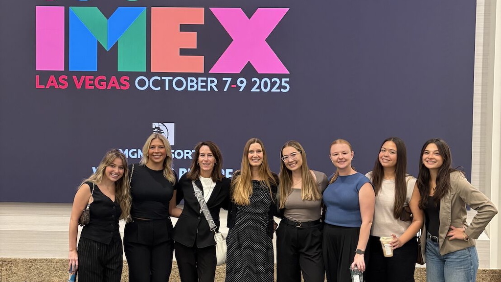 Six event mgmt seniors posing for a picture with Tracy and Heather